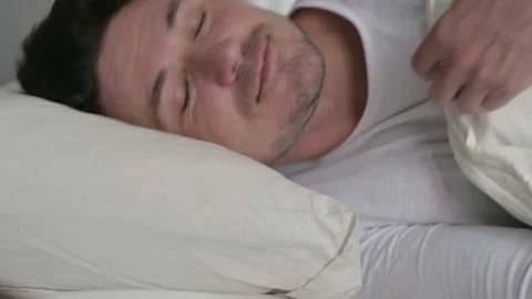 Middle Aged Man Going to Sleep in Bed Stock Footage 142366652