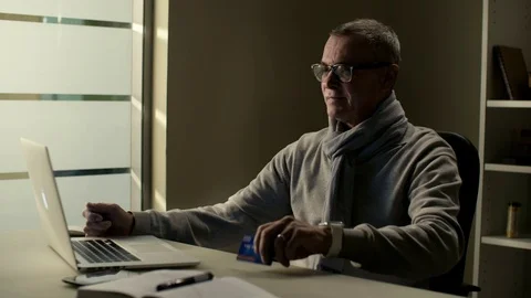 Middle aged man with grey hair use smart watch to check status of order in Stock Footage 72137461