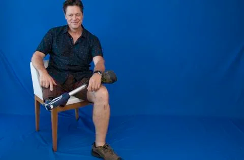 Middle-aged man, handicapped, happy with life. Stock Photos