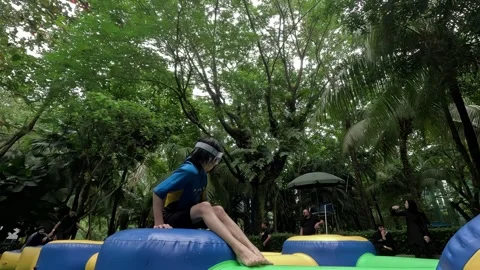 A middle-aged man is having fun near the floating giant balloon Stock Footage 293733946