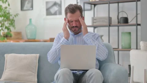 Middle Aged Man having Headache with Laptop in Lap Stock Footage 287897915