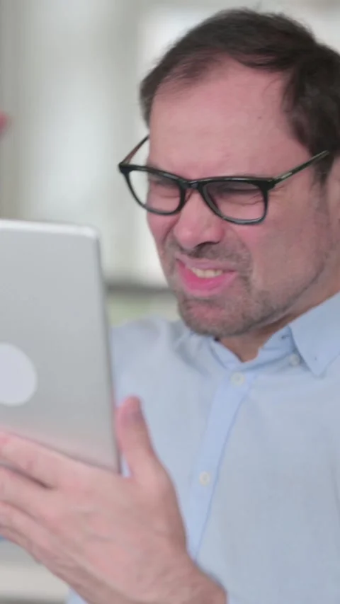 Middle Aged Man having Loss on Tablet in Office, Vertical Video 動画素材 339584263