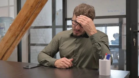 Middle Aged Man with Headache Sitting at Work Stock-Footage 307199726