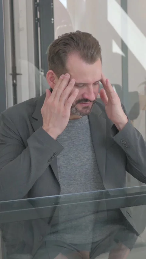 Middle Aged Man with Headache Talking with Doctor, vertical video Stock Footage 324693482