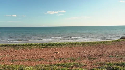 A middle-aged man in a housecoat, on the ocean, jumps, seized with happiness Stock Footage 130218070