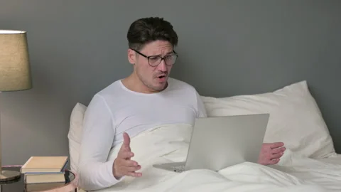 Middle Aged Man with Laptop having Loss in Bed 스톡 동영상 142374809