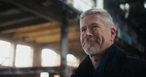 Middle aged man looking around and taking pictures with retro camera Stock Footage 300793058