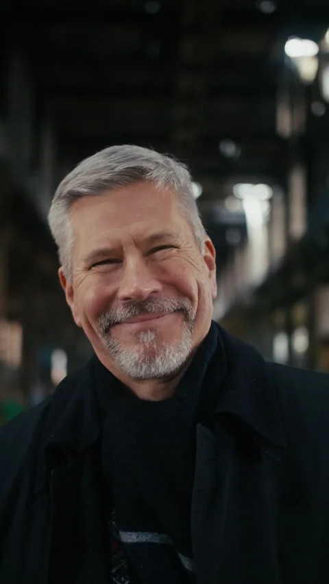 A middle aged man looking in the camera and laughing uncontrollably. Stock Footage 300790676