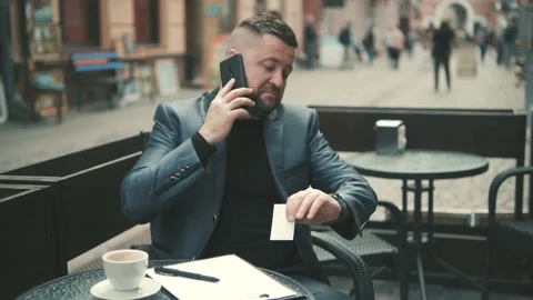Middle-aged man in luxurious clothes answers the call of his mobile phone. Stock Footage 172504593