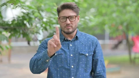 Middle Aged Man Making Denial Gesture Outdoors Video stock 311375492