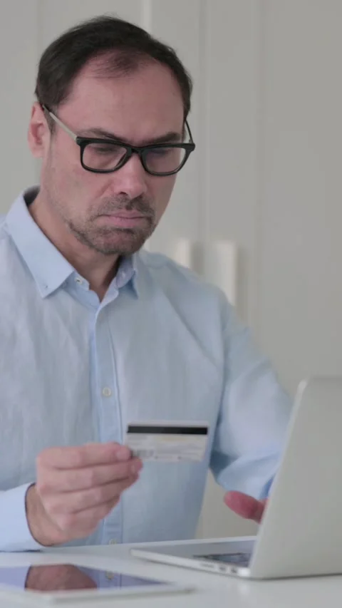 Middle Aged Man making Successful Online Payment on Laptop, Vertical Video 스톡 동영상 339584676