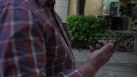 Middle aged man with mask walking in Athens during a sunny day Stock Footage 167840123