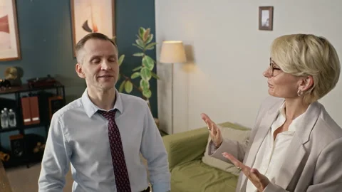 Middle-aged Man with Middle-aged Female Therapist Doing Breathing Exercise Stock Footage 340630237