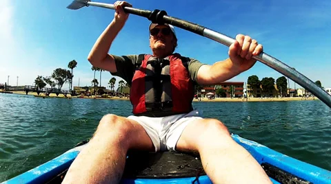 Middle Aged Man Paddling Sea Kayak On Alamitos Bay Stock Footage