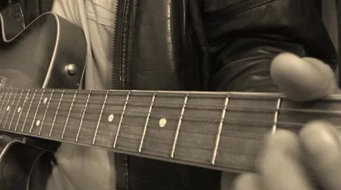 Middle-aged man playing guitar Stock Footage 2402252