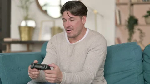 Middle Aged Man Playing Video Game at Home Video stock 142372268