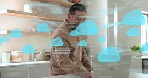 Middle-aged man pouring coffee typing on laptop exploring cloud data with binary Stock Footage 318307511
