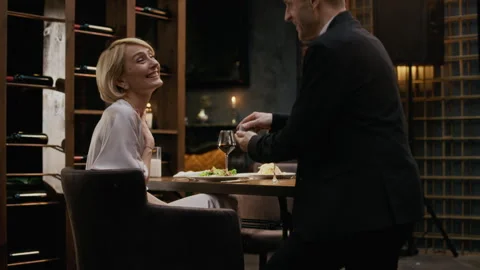 Middle-Aged Man Proposing during Romantic Dinner in Luxury Restaurant Stock Footage 333397836