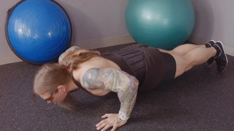 A middle-aged man is pushing himself off the floor Stock Footage 115432067