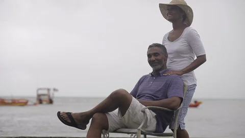Middle-aged man receiving a massage from his partner. Stock Footage 88369627