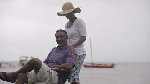 Middle-aged man receiving a massage from his partner. Stock Footage 88369632