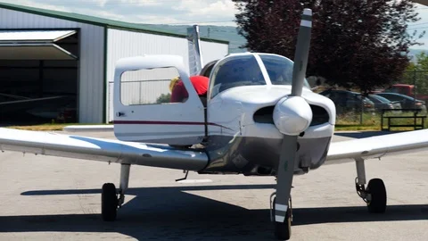 Middle aged man repairs the door of light plane with the single propeller 스톡 동영상 115894898