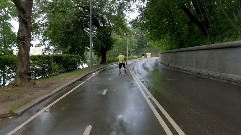 A middle-aged man, riding on roller skis with sticks Video stock 113060676
