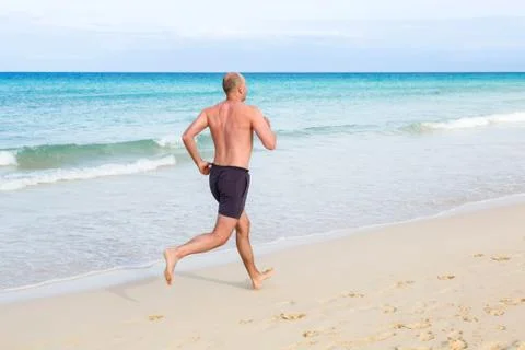Middle aged man running Stock Photos