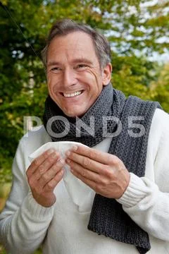 Middle Aged Man With Scarf And Tissue