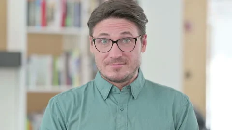 Middle Aged Man Shaking Head as Yes Sign Video stock 145759796