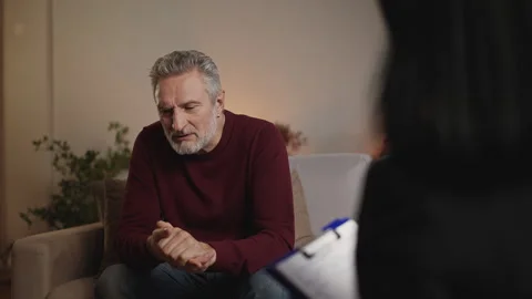 Middle-aged man sharing relationship problems with psychologist during therapy Stock Footage 340920184