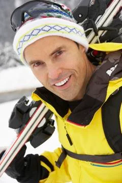 Middle Aged Man On Ski Holiday In Mountains Stock Photos
