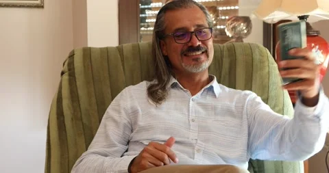 Middle aged man with smartphone making selfie photo 1 Stock Footage 141687830