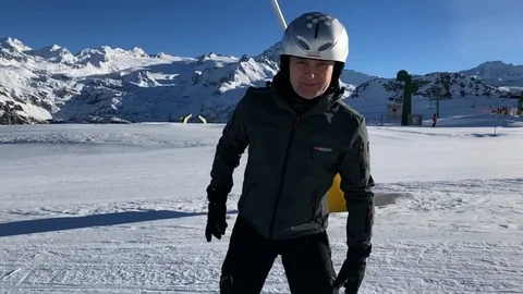 Middle-aged man snowboarding in Alps slow motion Stock Footage 103799806
