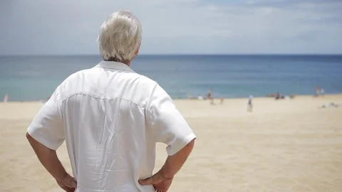 Middle-aged man standing on a beach. Stock-Footage 88369947