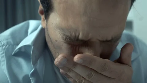 Middle-aged man suffering panic attack, feeling extremely nervous, rubbing face Stock Footage 119298588