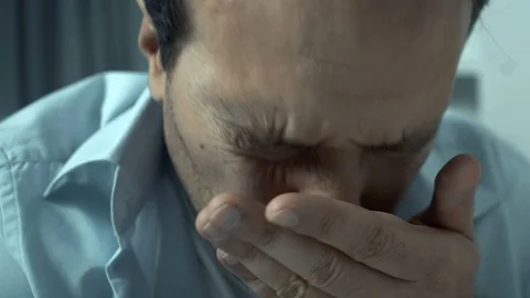Middle-aged man suffering panic attack, feeling extremely nervous, rubbing face Vídeo Stock 119299115