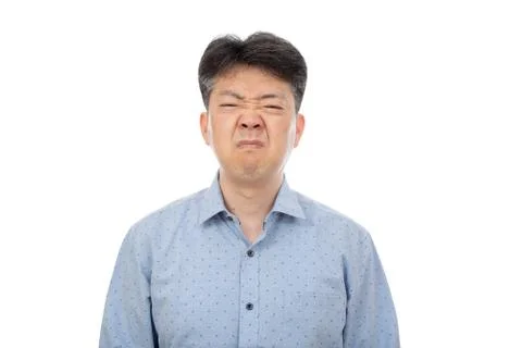 A middle-aged man suffering from rhinitis on white background. Stock Photos