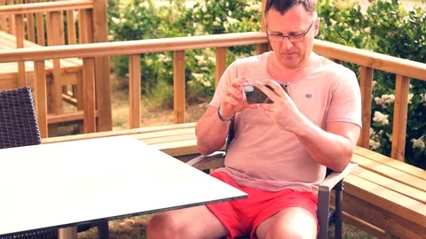 Middle-aged man taking a selfie on a mobile Video stock 94062015