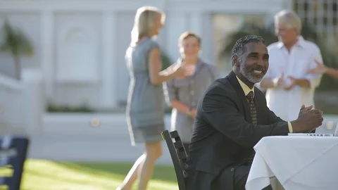 Middle-aged man talking at a table. Stock Footage 88370156