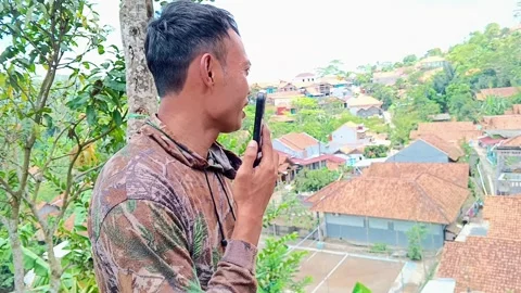 A middle-aged man talks on his mobile phone. Stock Footage 319217435