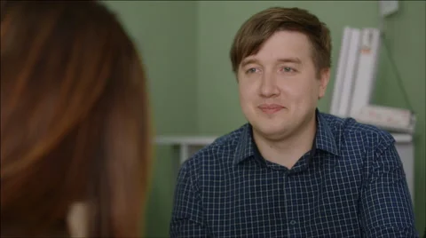 Middle-aged man talks to a manager in the office Stock Footage 40690374