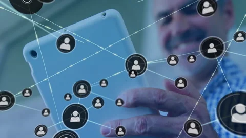 Middle-aged man tapping tablet and forming branching tech network diagram for Vídeo Stock 310643287