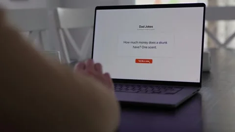 Middle Aged Man Testing Dad Joke Generator Website 動画素材 332947421