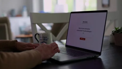 Middle Aged Man Testing Dad Joke Generator Website 動画素材 332947423