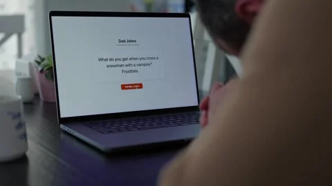 Middle Aged Man Testing Dad Joke Generator Website 動画素材 332947424
