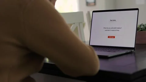 Middle Aged Man Testing Dad Joke Generator Website 動画素材 332947428