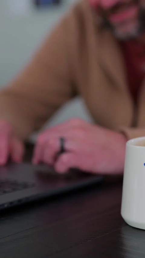 Middle Aged Man Testing Dad Joke Generator Website 動画素材 332947432