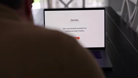 Middle Aged Man Testing Dad Joke Generator Website 動画素材 332947433