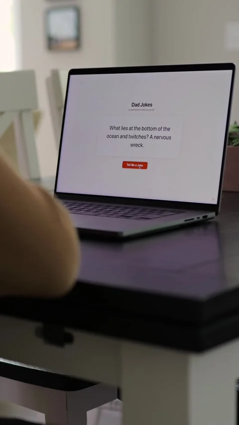 Middle Aged Man Testing Dad Joke Generator Website 動画素材 332947435